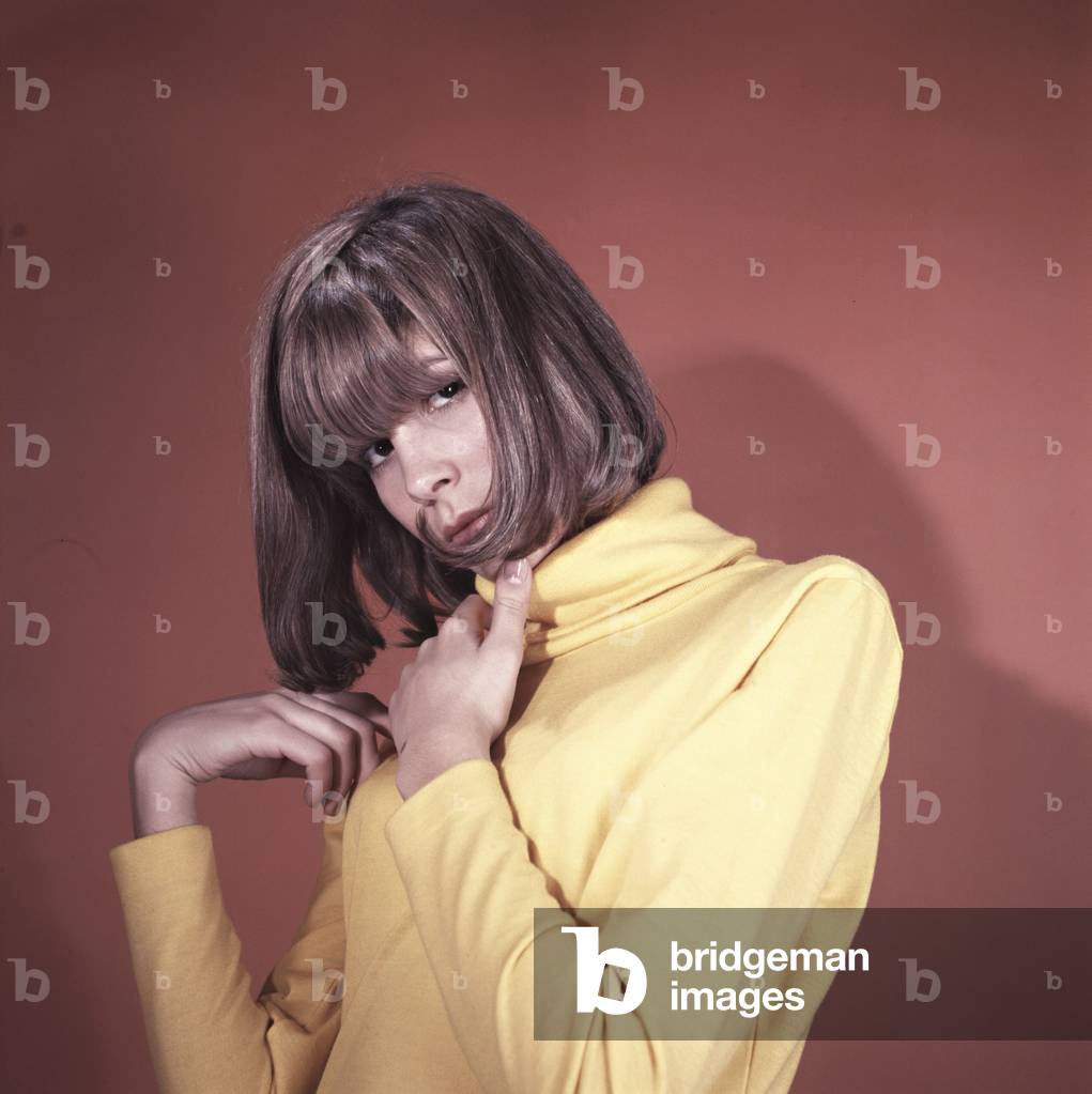 Marisa Sannia wearing a yellow turtleneck