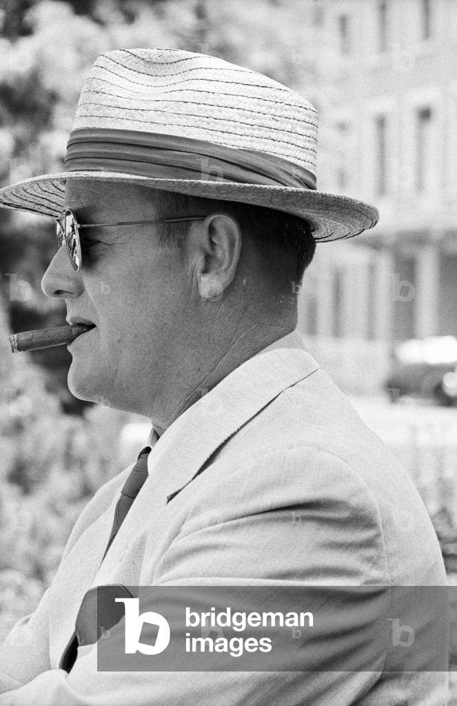 Portrait of a man having a cigar in Geneva, Geneva, Switzerland
