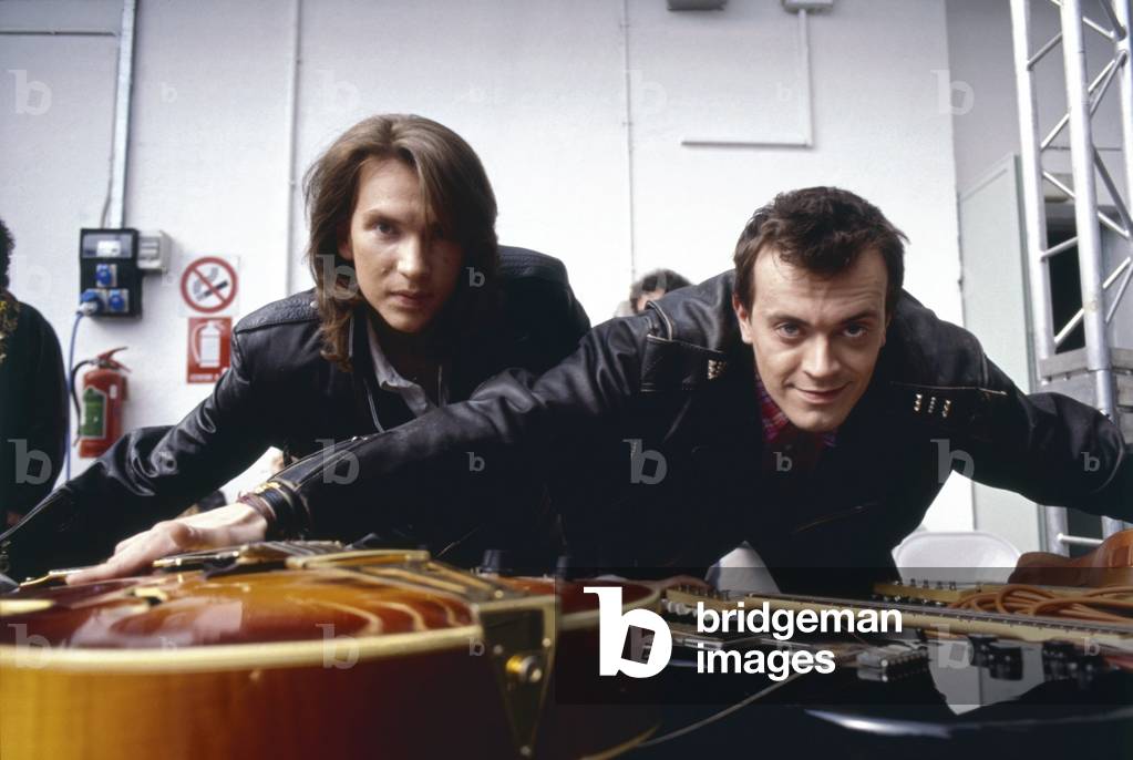 883 leaning on some guitars