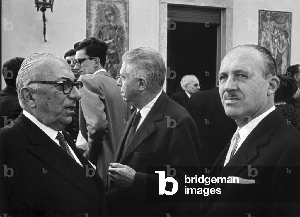 Italian publisher Arnoldo Mondadori celebrating his golden wedding with Italian poet Eugenio Montale and Italian writer Guido Piovene, Meina, October 1963 (b/w photo)