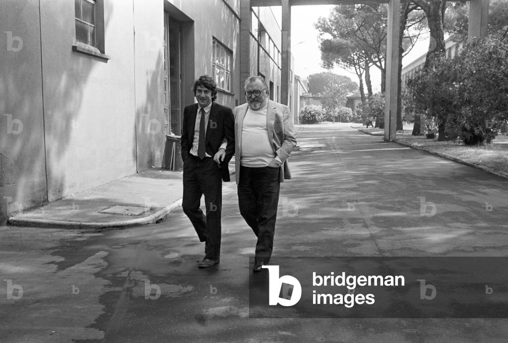 Sergio Leone and Robert De Niro in the alleys of Cinecittà, Italy, 1980 (b/w photo)