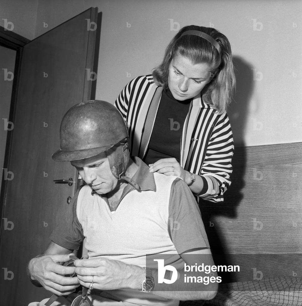 Louise Collins looking at Peter Collins at the Mille Miglia Automobile Race, Italy