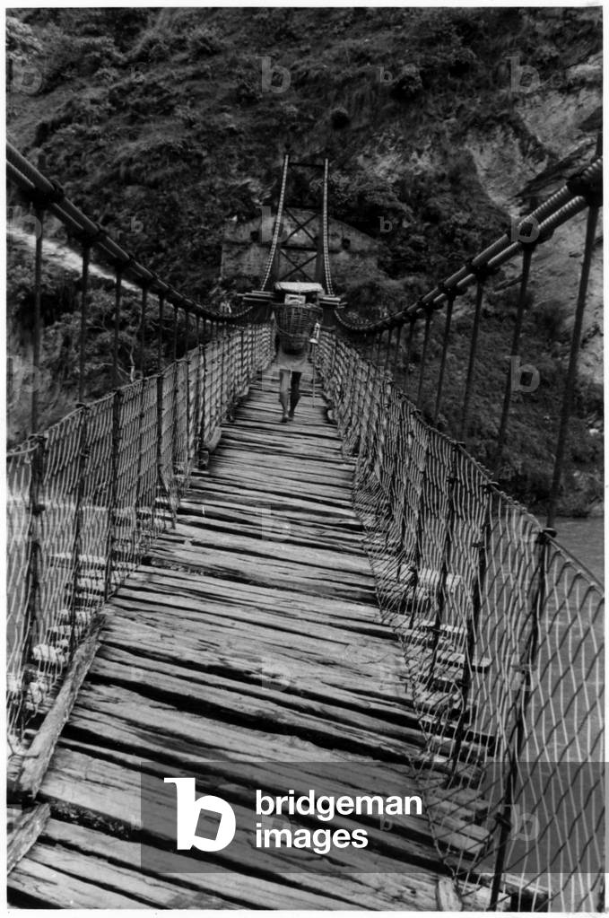 A guide on a wooden bridge