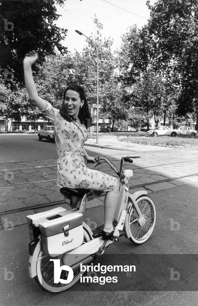 Girl on a Piaggio Ciao motor-scooter, Italy