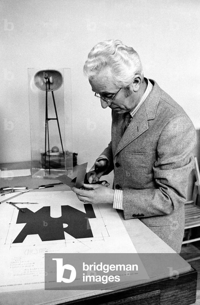Bruno Munari working in his studio, 1969 (b/w photo)