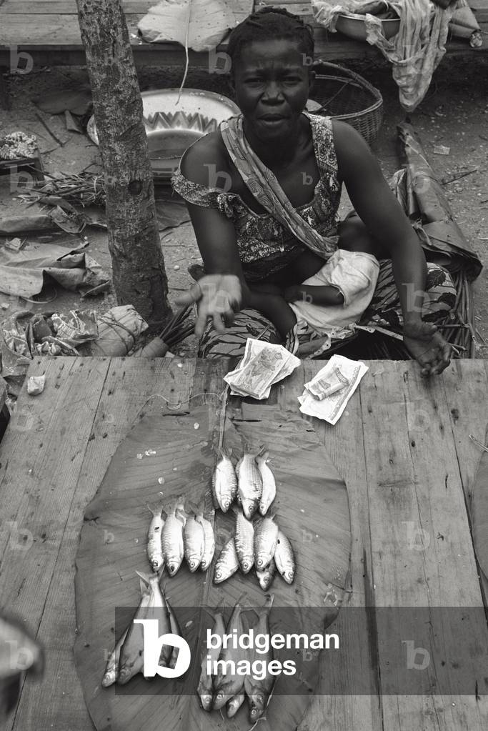 African woman selling fish, Mosnago, Congo, 1966