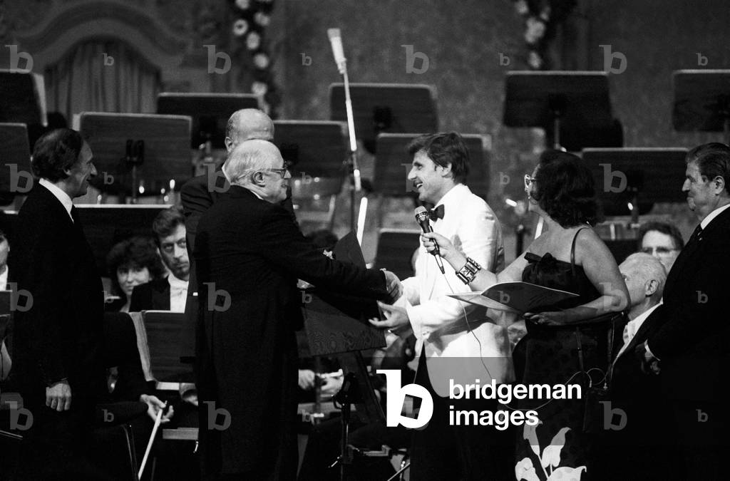 Slava Rostropovich shaking hands with a man