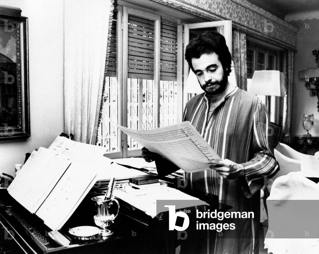 Manuel De Sica studying a sheet