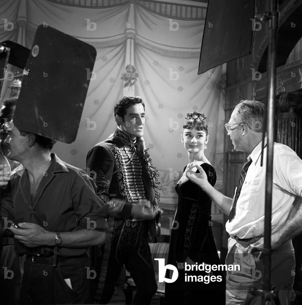 Vittorio Gassman, Audrey Hepburn and King Vidor on the movie set of War and Peace (b/w photo)