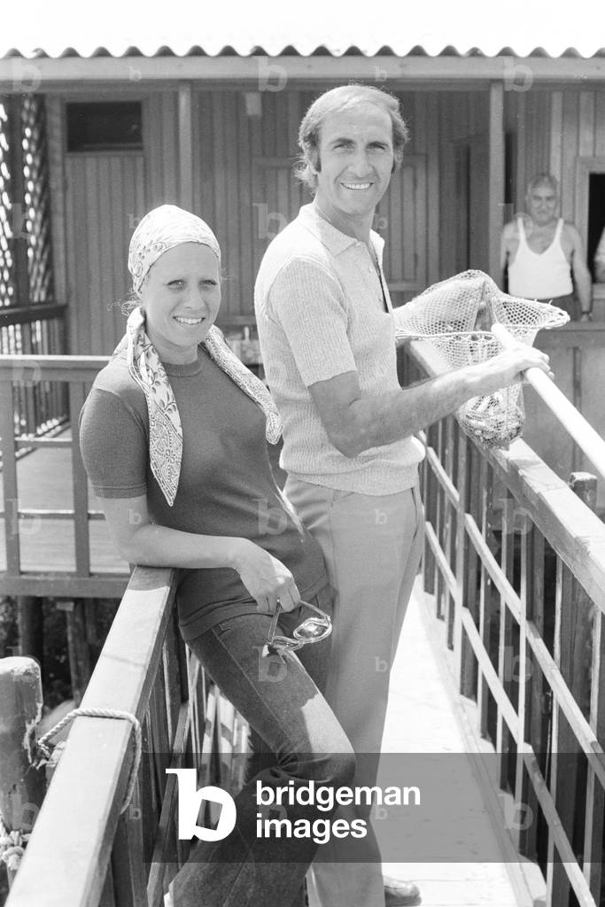 Italian TV host Pippo Baudo on holiday with his wife Angela Lippi, Italy, 1972 (b/w photo)