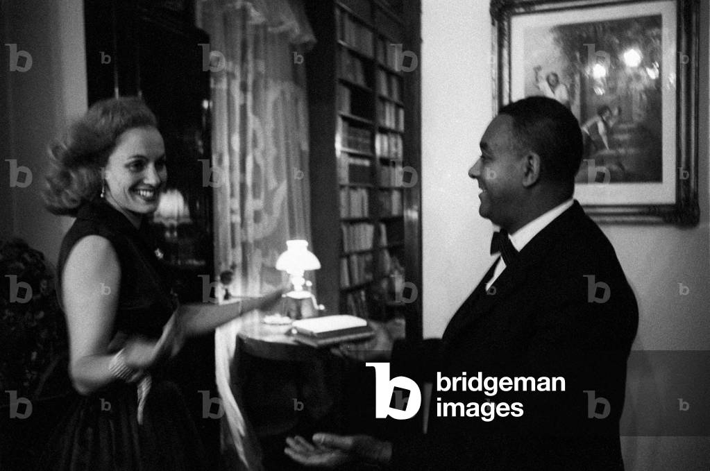 Richard Wright greeting a woman