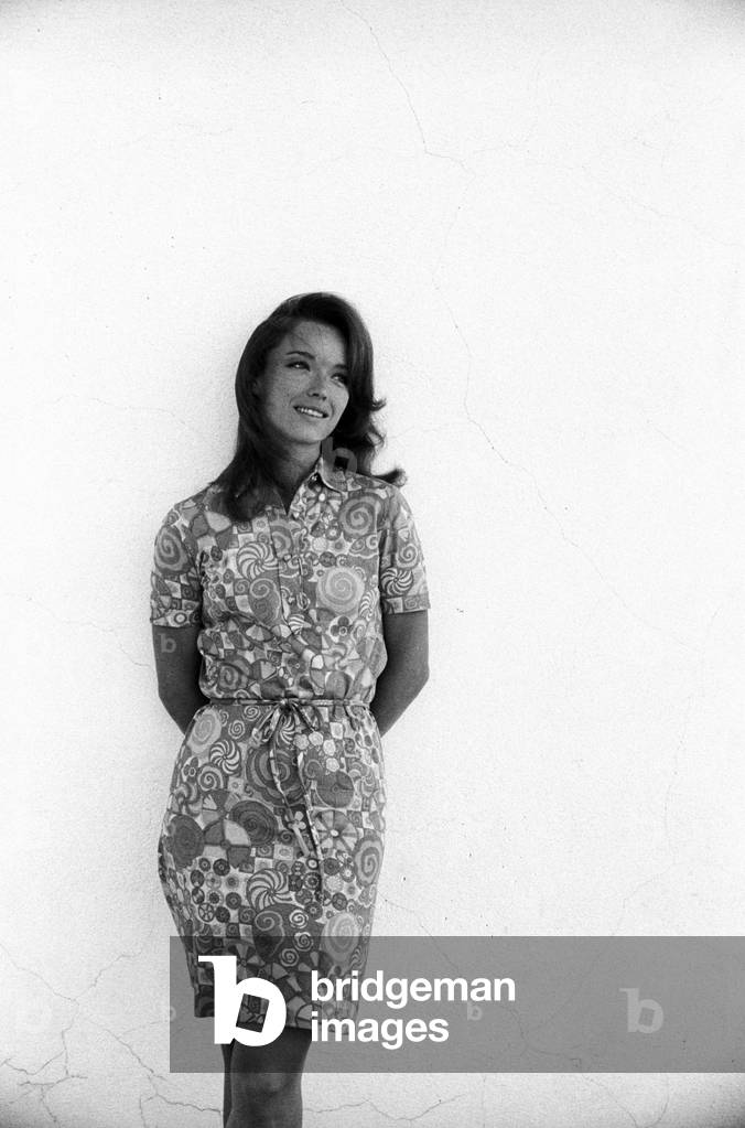 Aba Cercato leaning to a white wall, Rome, Italy