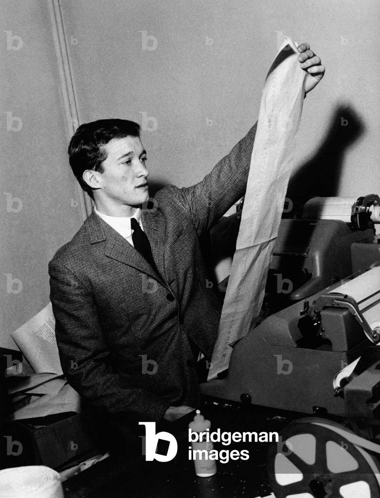 Fabrizio Ferretti examining a long list