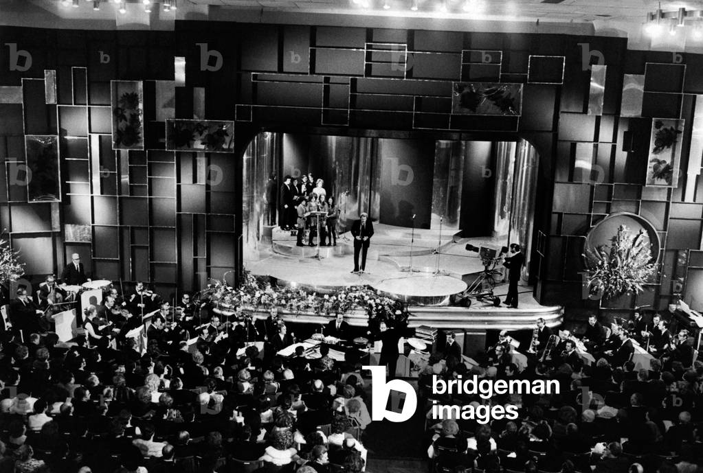 Domenico Modugno on stage at the Sanremo Music Festival, 1971 (b/w photo)