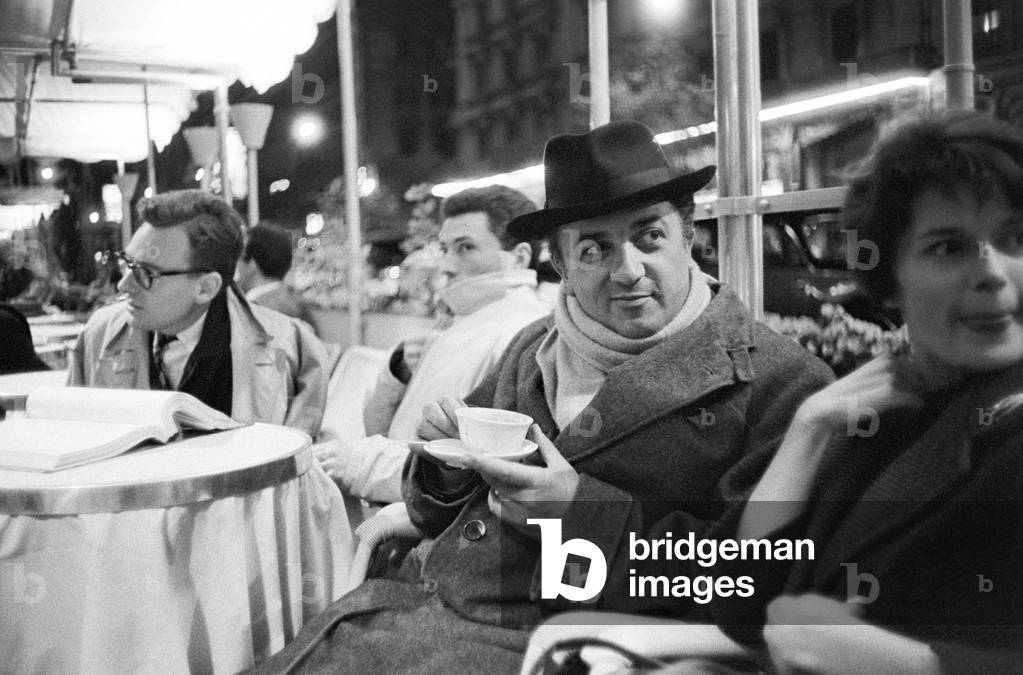 Federico Fellini in a Via Veneto café, Italy, 1959 (b/w photo)