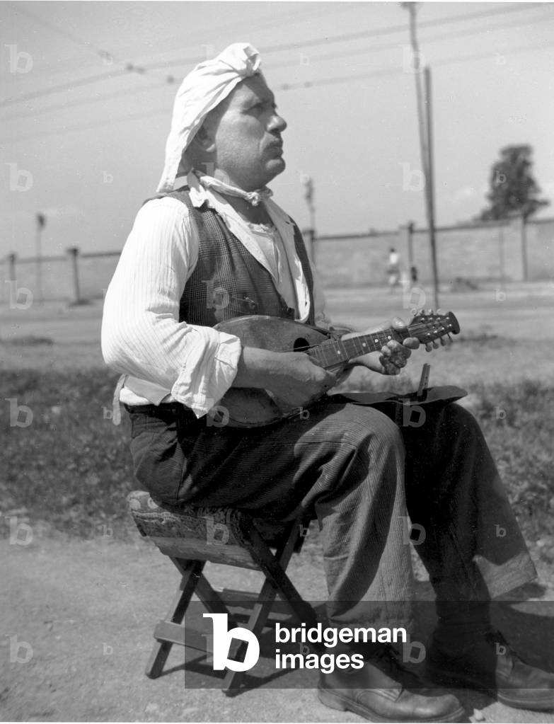 A man playing mandolin, Italy, 1950 (b/w photo)