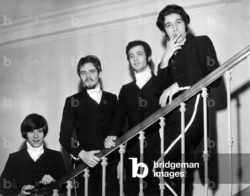 I Giganti posing on a staircase