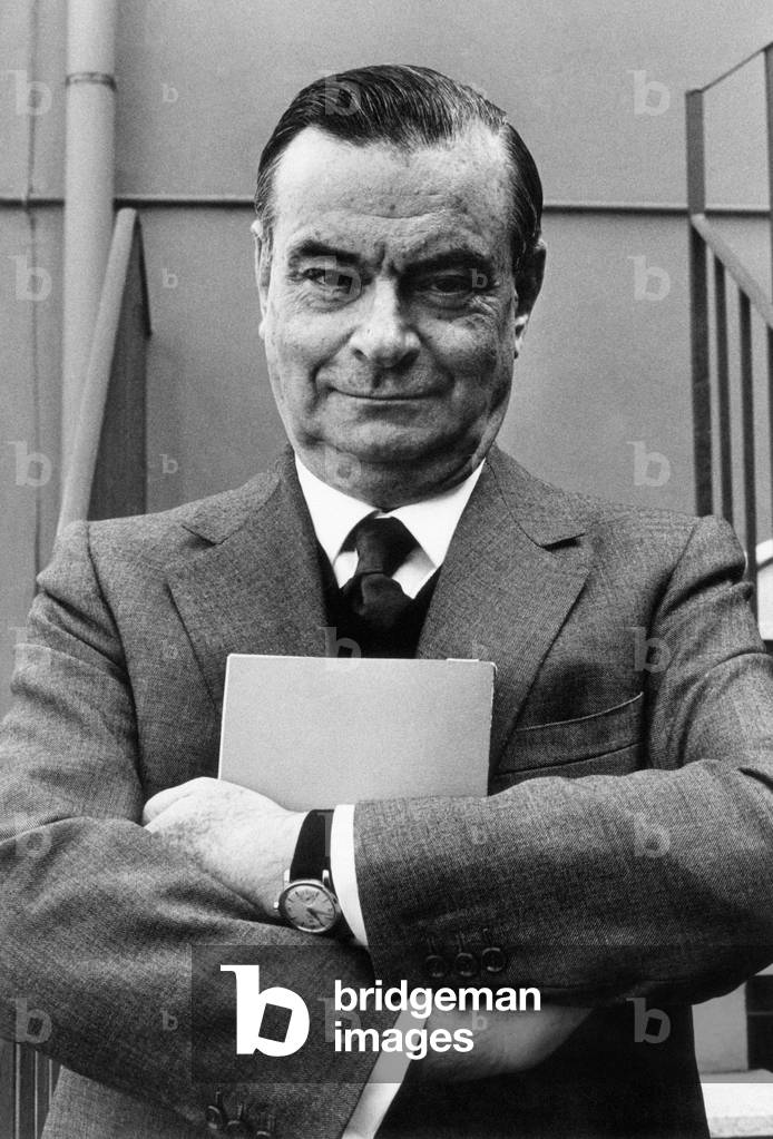Giovanni Malagodi posing on a staircase, Italy, 1970 (b/w photo)