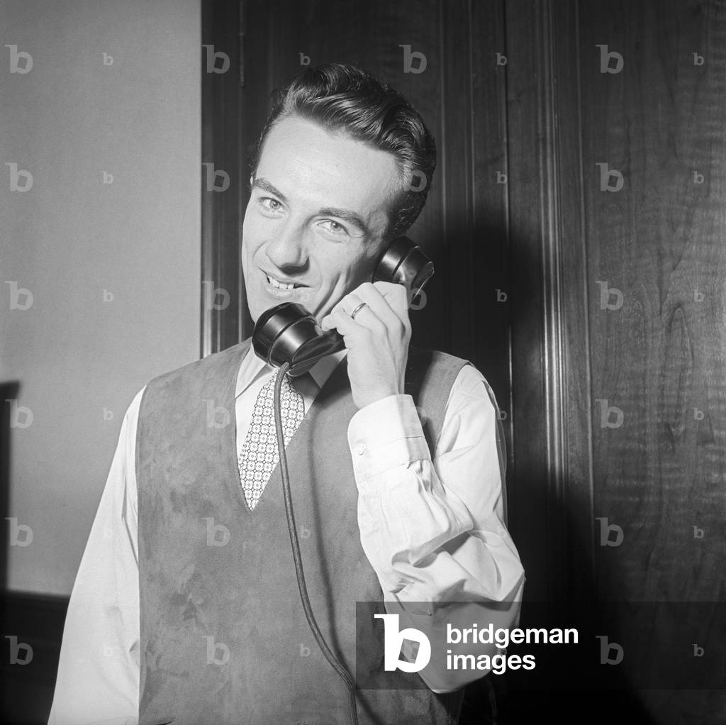 Febo Conti on the phone, Italy, 1953 (b/w photo)