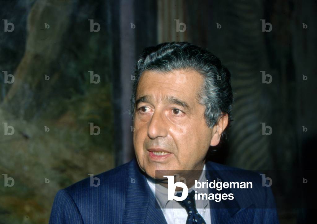 Carlo De Benedetti attending a public meeting, 1990 (b/w photo)