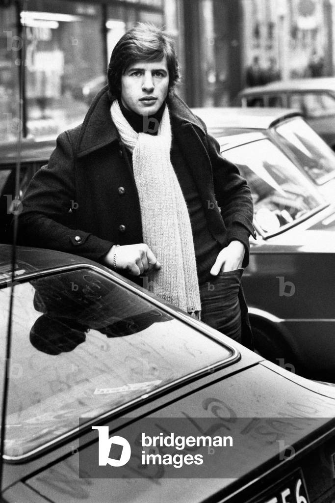 Sandro Giacobbe among parked cars