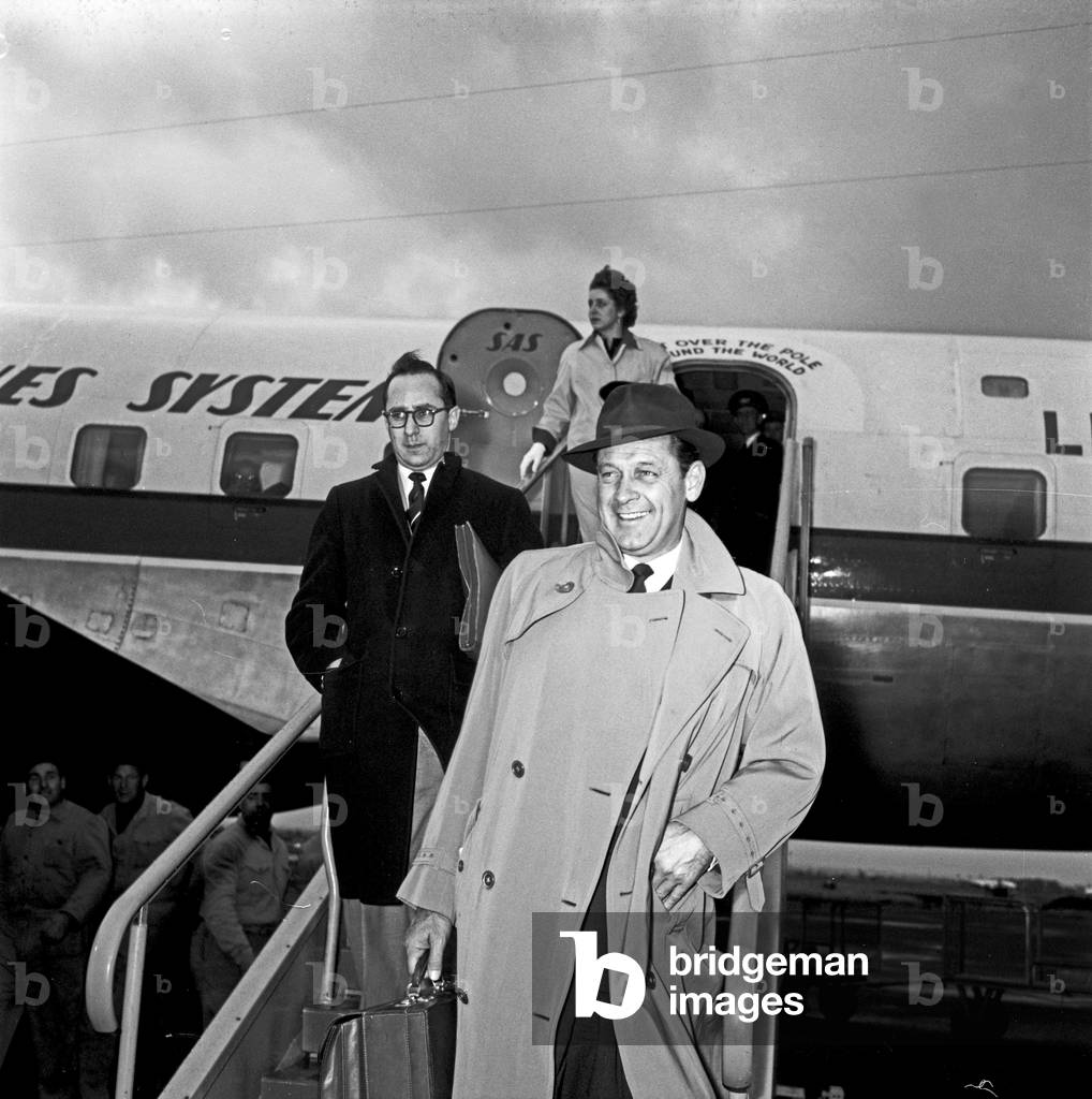 William Holden arriving at Ciampino airport, Ciampino, Italy, 1958 (b/w photo)