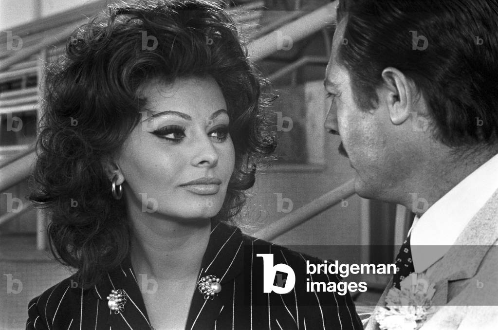 Sophia Loren looking at Marcello Mastroianni, 1964 (b/w photo)