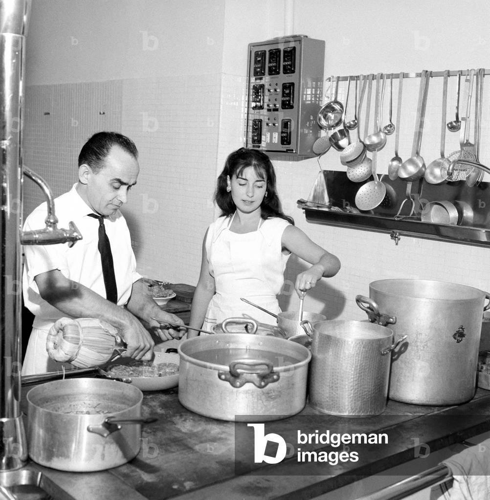 A man and a young woman cooking