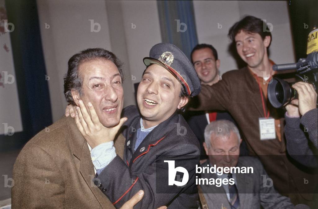 Piero Chiambretti hugging Adriano Aragozzini's face