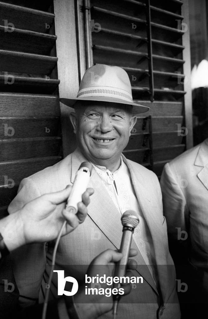 Nikita Khrushchev is smiling to the journalists