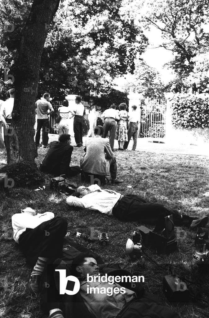 Photographers relaxing on the grass during the Geneva Summit, Geneva, Switzerland