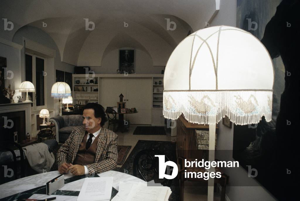 Paolo Portoghesi seated in the living-room of his house during an interview