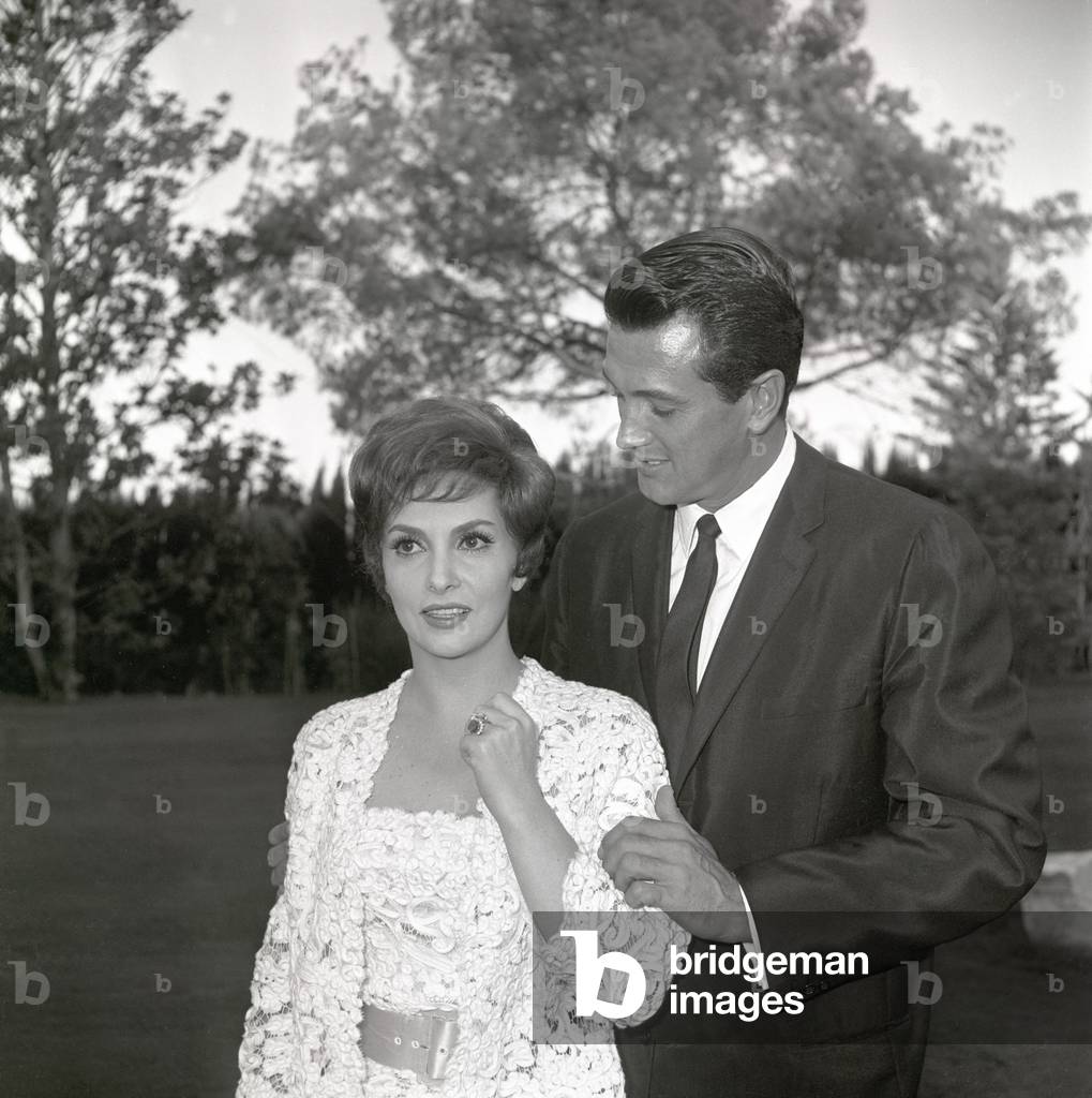 Rock Hudson touching Gina Lollobrigida's arm, Italy, 1959 (b/w photo)