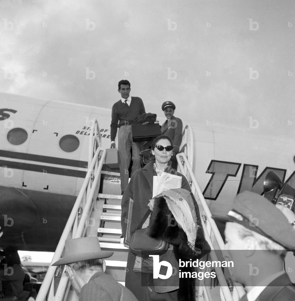 Walter Chiari and Ava Gardner arriving at Ciampino airport, Italy, 1956 (b/w photo)
