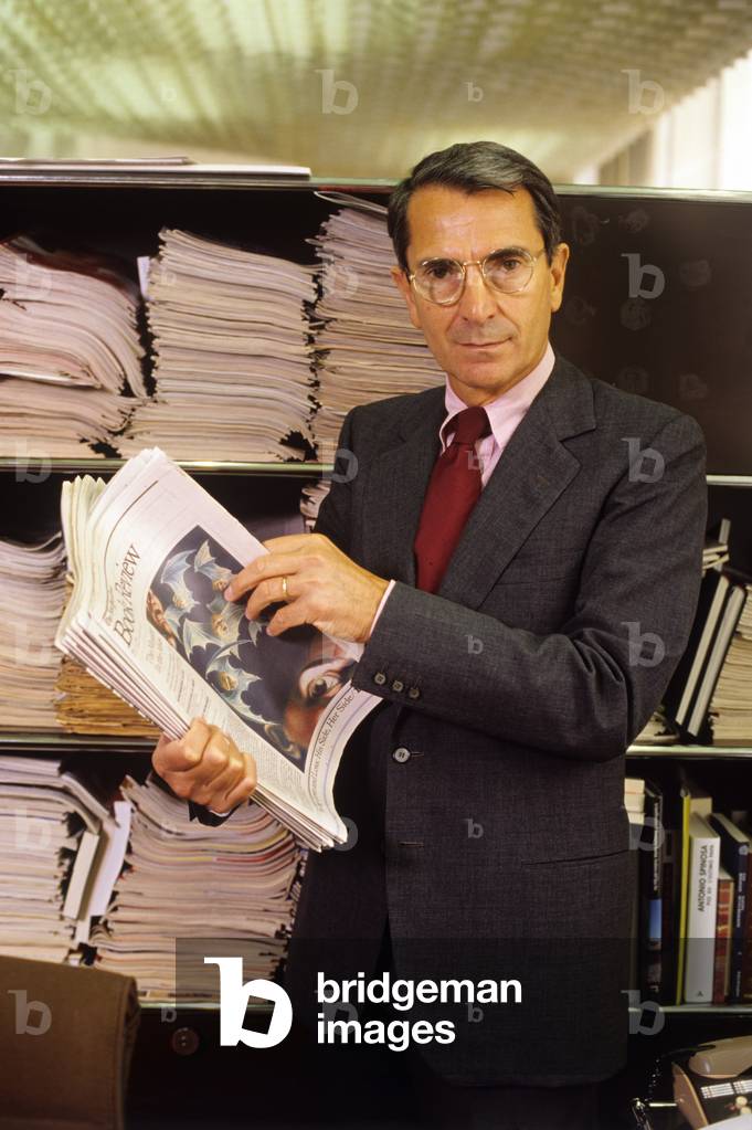 Carlo Rossella skimming through a number of Book Review