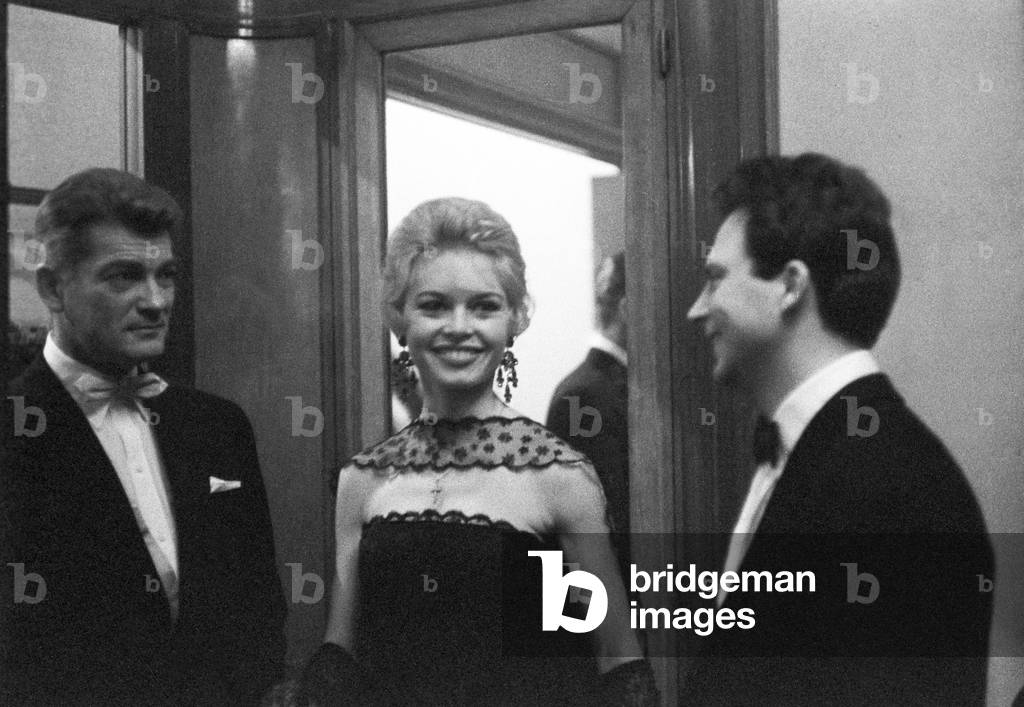 Jean Marais, Brigitte Bardot and Franco Interlenghi at the premiere of the film Love Is My Profession, France, Paris, 1958 (b/w photo)