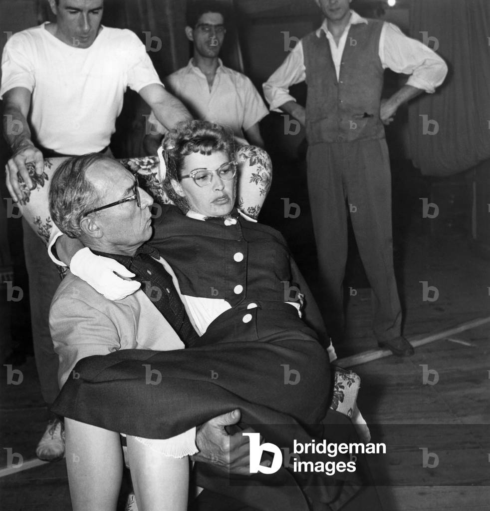 American actor and director Buster Keaton holding his wife, American actress Eleanor Norris in his arms, Milan, Italy, 1953 (b/w photo)