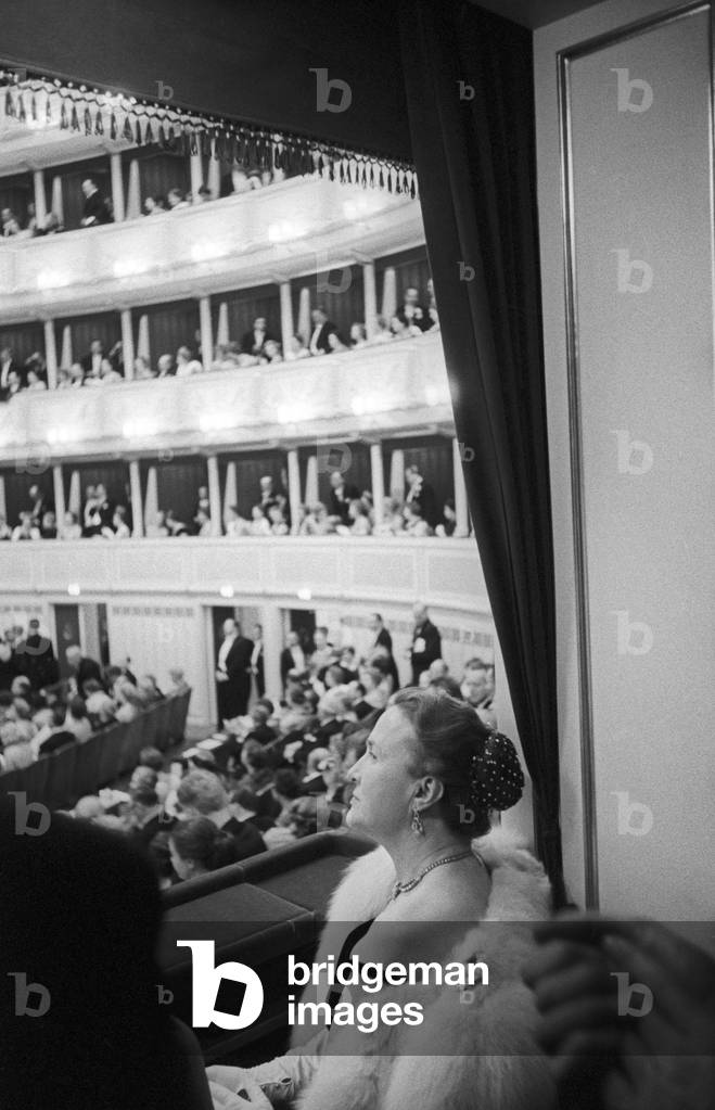 A woman at the reopening of the Vienna State Opera, Vienna, Austria