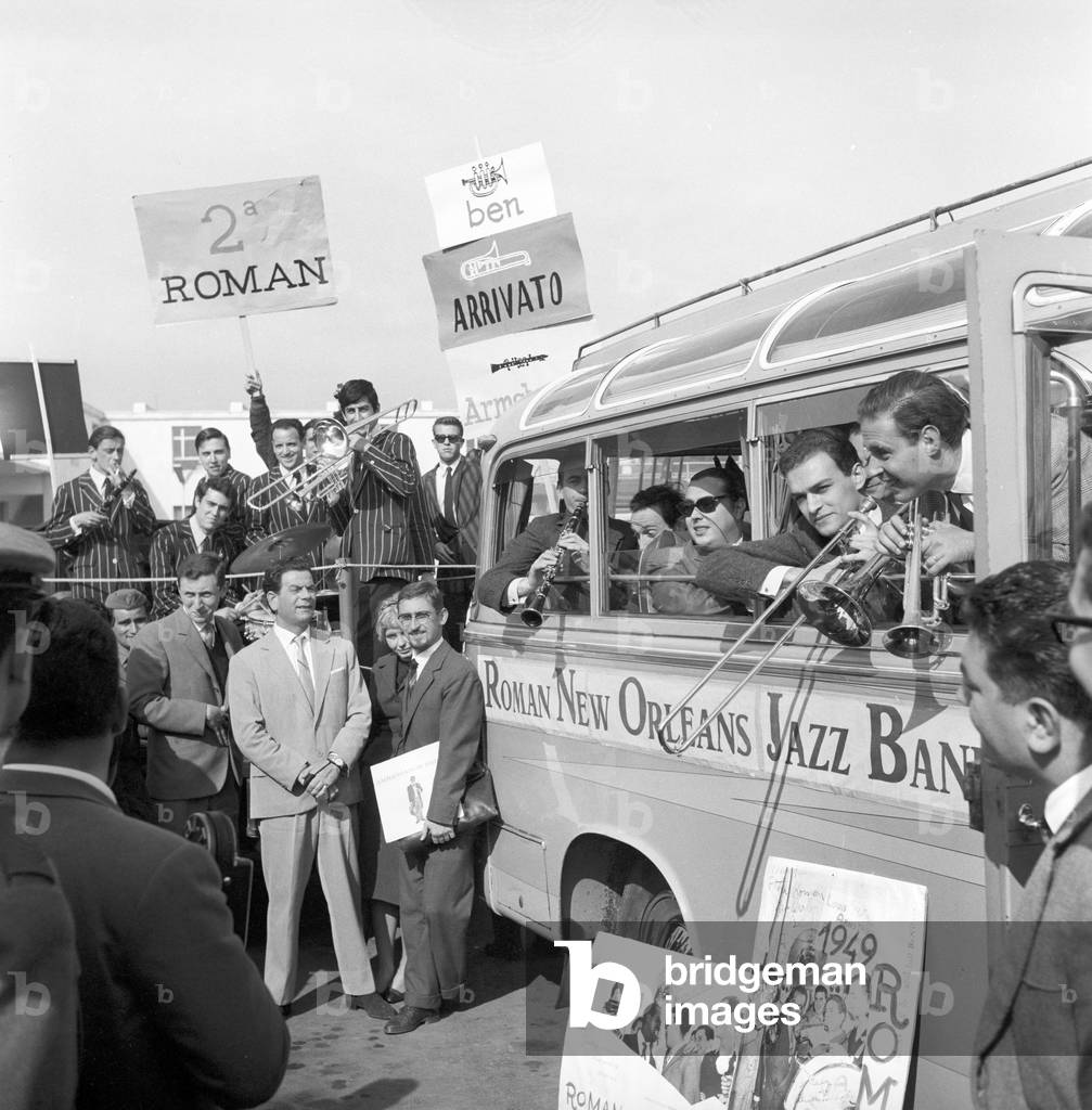 The Roman New Orleans Jazz Band playing on a truck at the Ciampino Airport, Ciampino, Italy, 1959 (b/w photo)