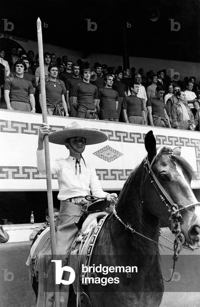 National football team players watching a folk festival
