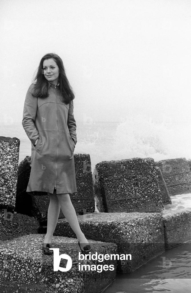 Catherine Spaak standing on some cliffs