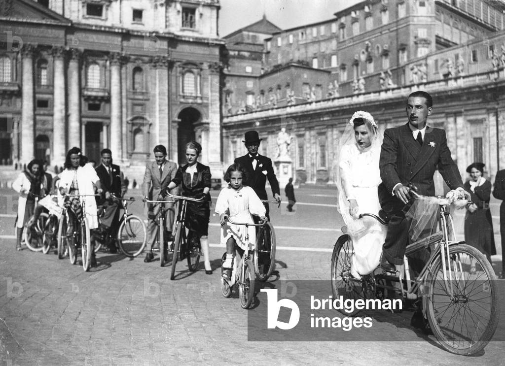 Newlyweds on a tandem bicycle