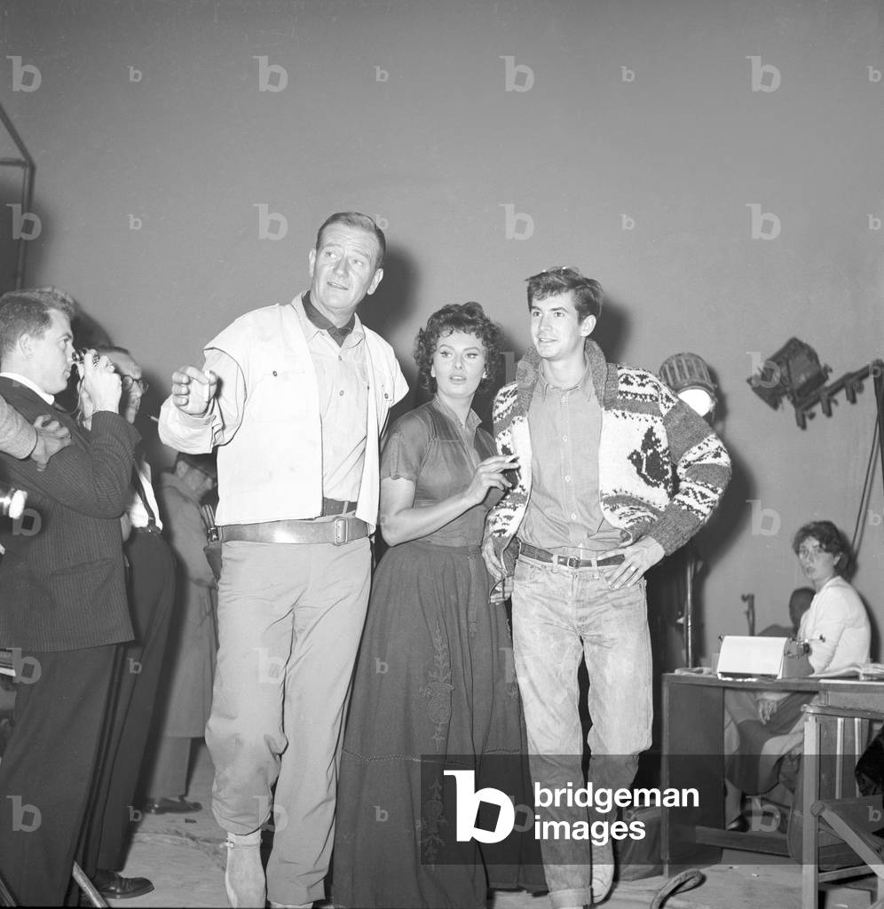 John Wayne, Sophia Loren and Anthony Perkins at Cinecittà  (b/w photo)