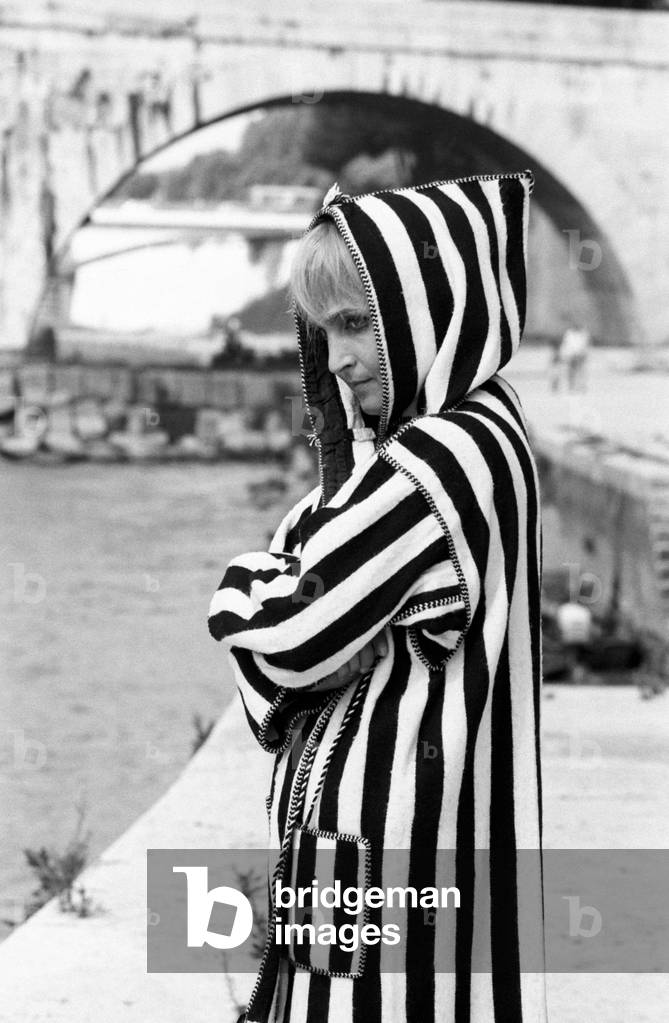 Laura Betti wearing a striped coat