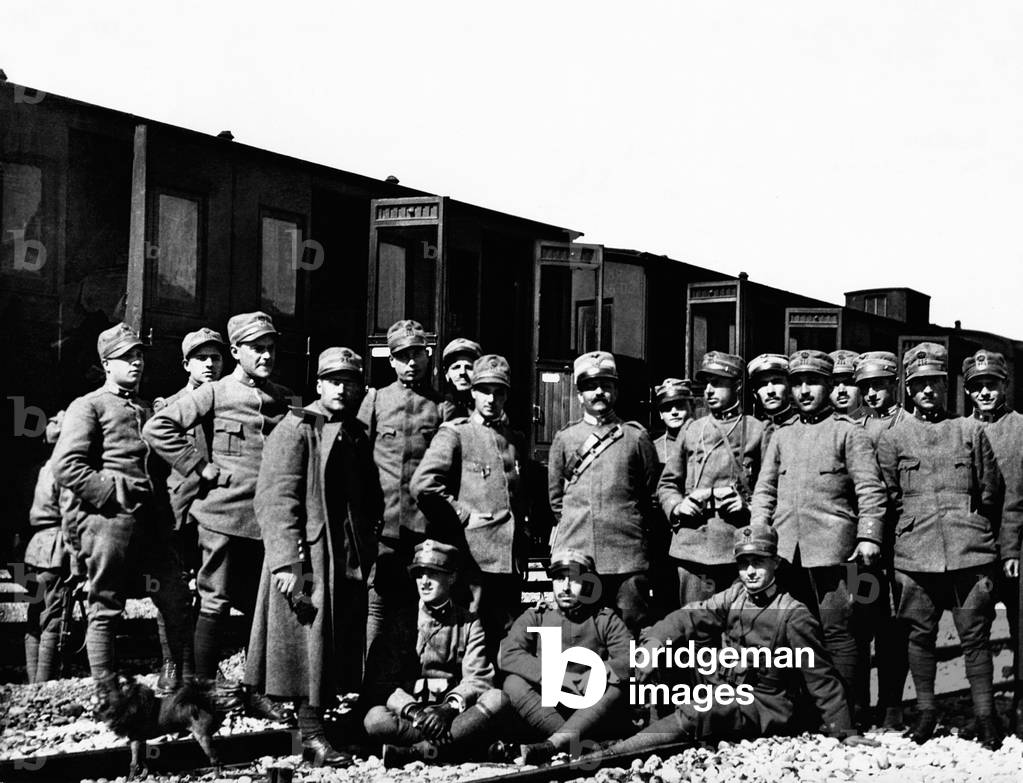 Portrait of Italian infantrymen waiting in a railway station