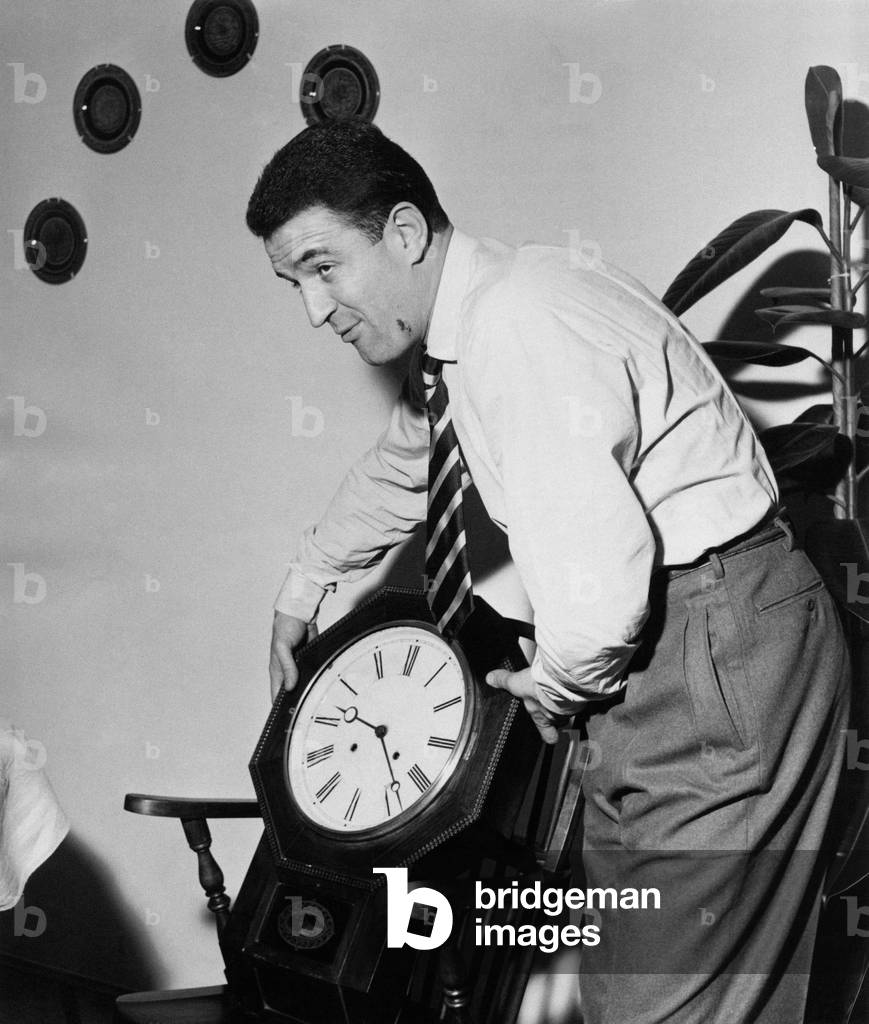 Rino Ferrario showing a clock