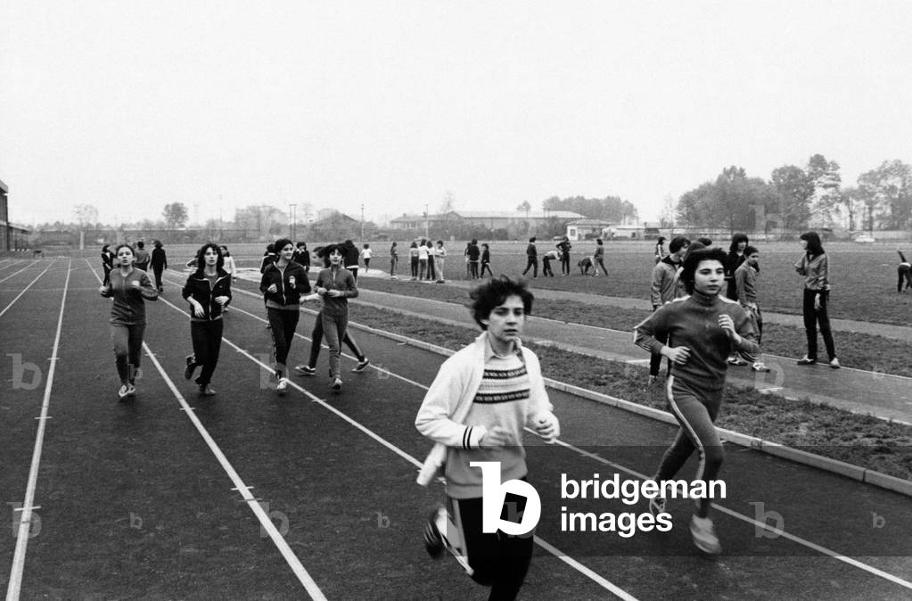 A group of students training on a running track