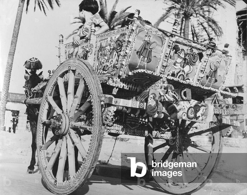 Little girls on a Sicilian cart, Italy, 1950 (b/w photo)