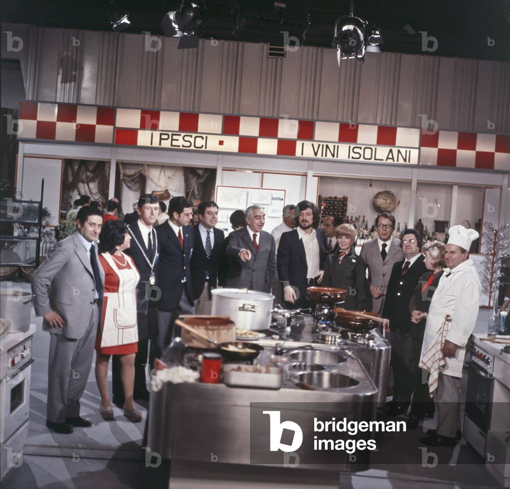 Delia Scala, Luigi Veronelli and Gigi Proietti posing in the studio of Colazione allo studio sette, Italy