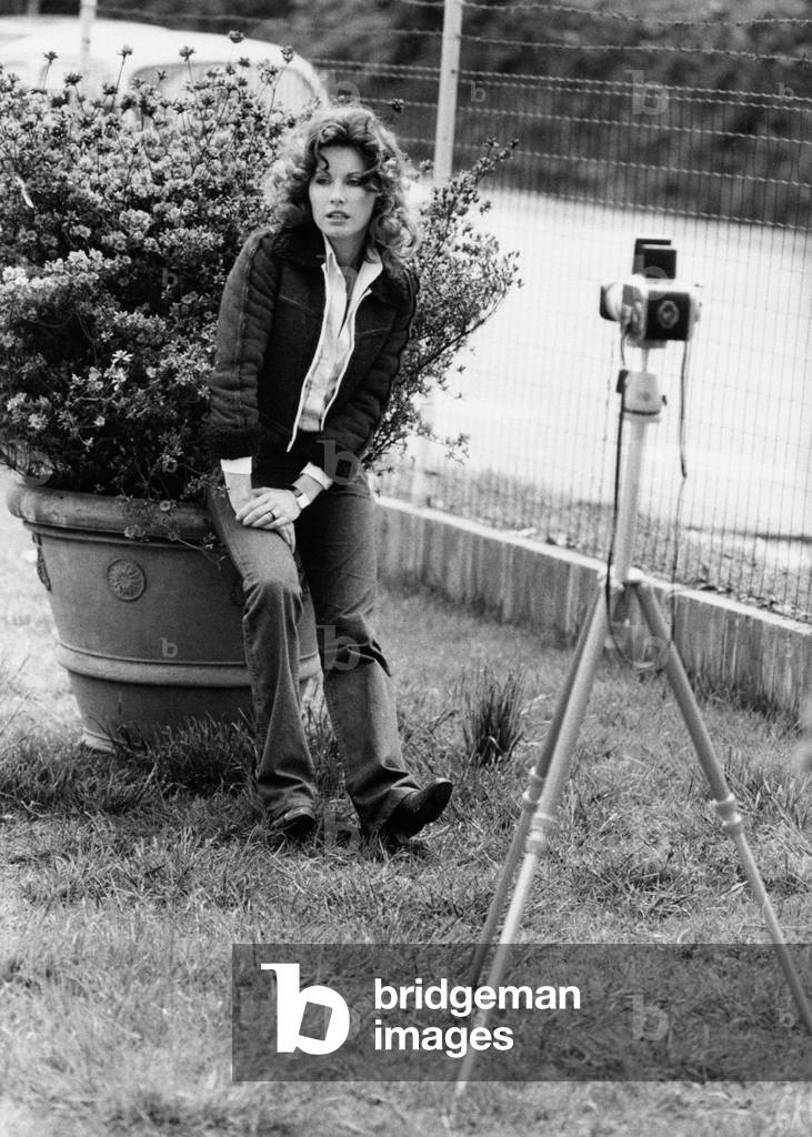 Gabriella Farinon sitting on a flowerpot